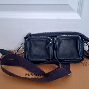 Leather multi compartment travel bag with adjustable strap